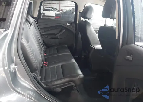 2014 Ford Escape Titanium z USA, uszkodzony, nr VIN 1FMCU0J91EUE57538